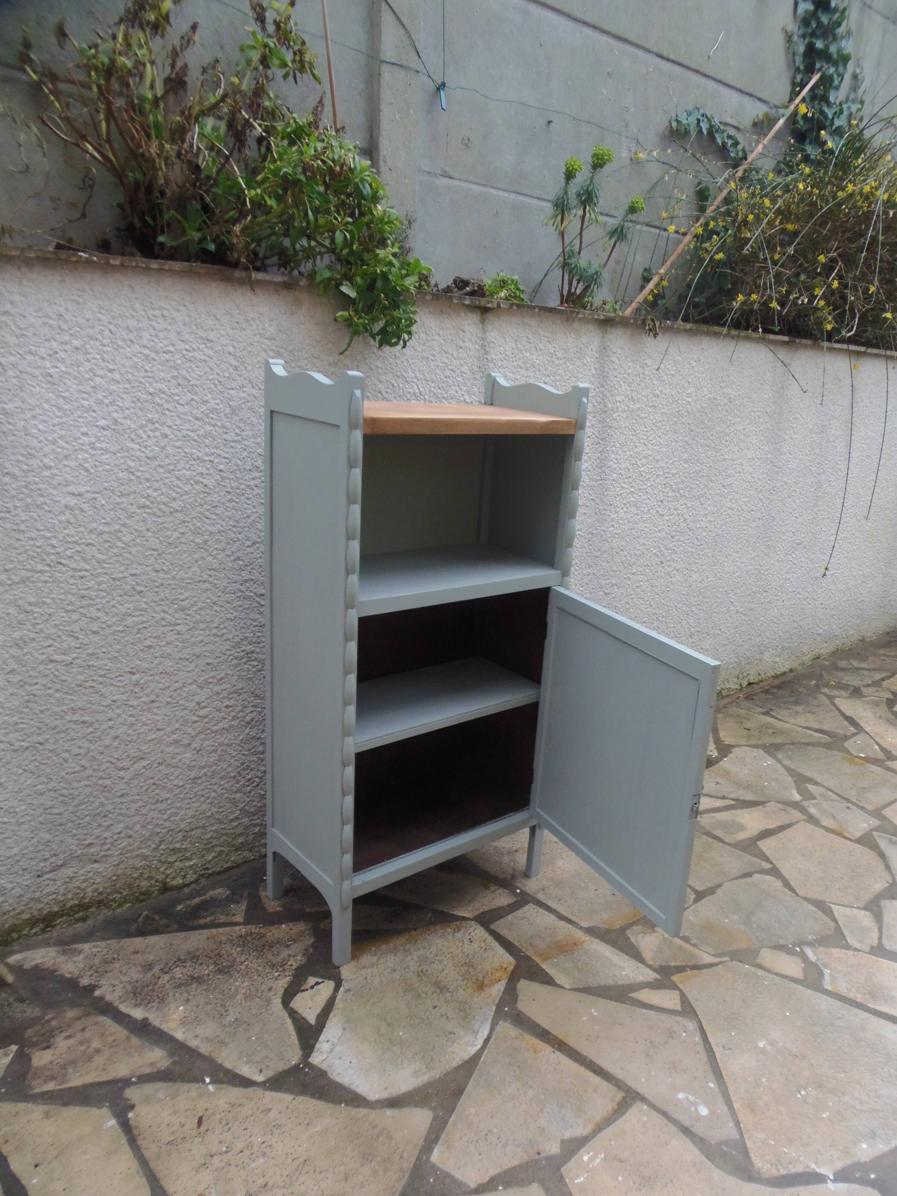 Vintage furniture of shallow depth re-enchanted in grey-green.