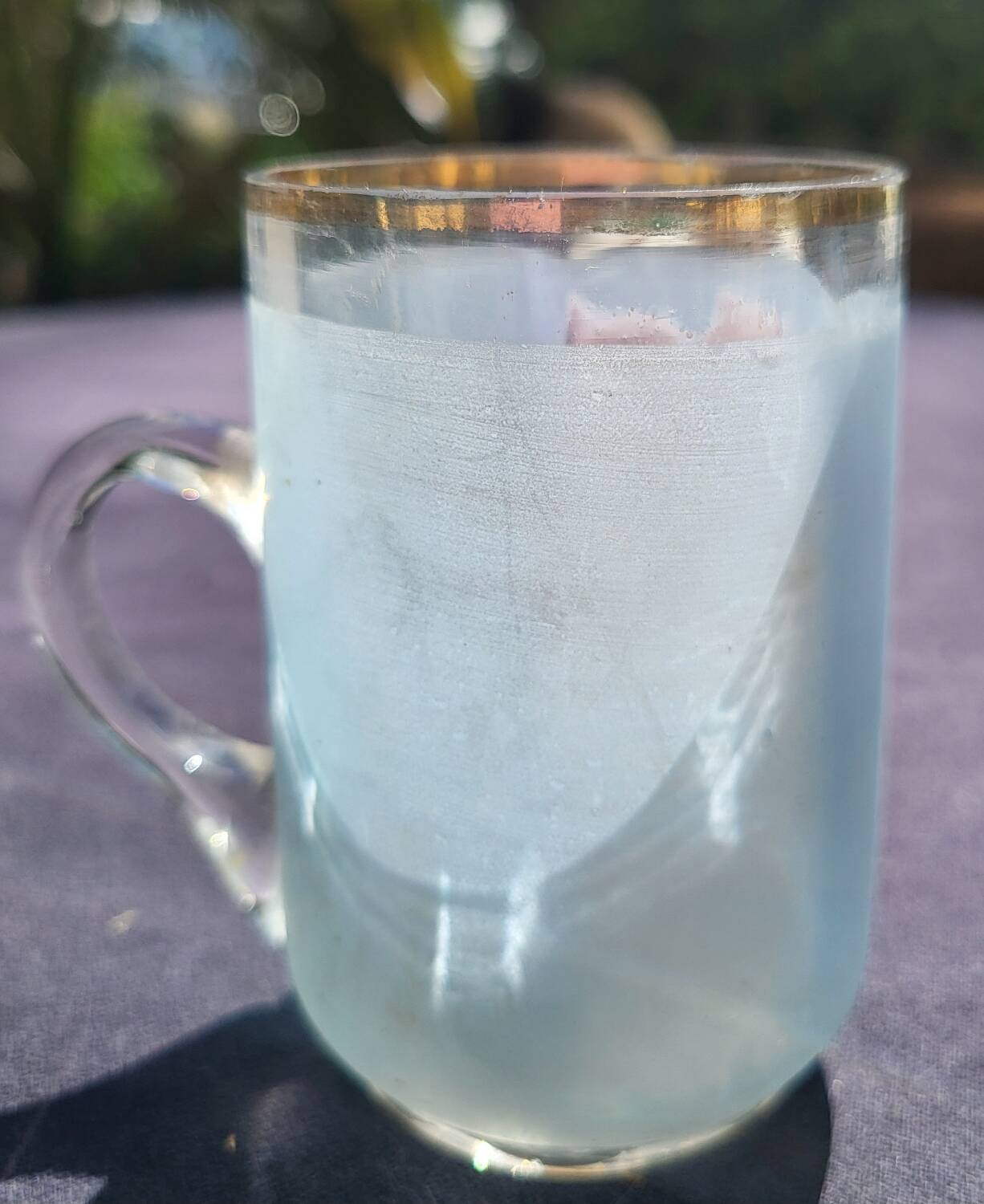 Old enameled blown glass cup