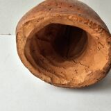 Terracotta face sculpture in African art style