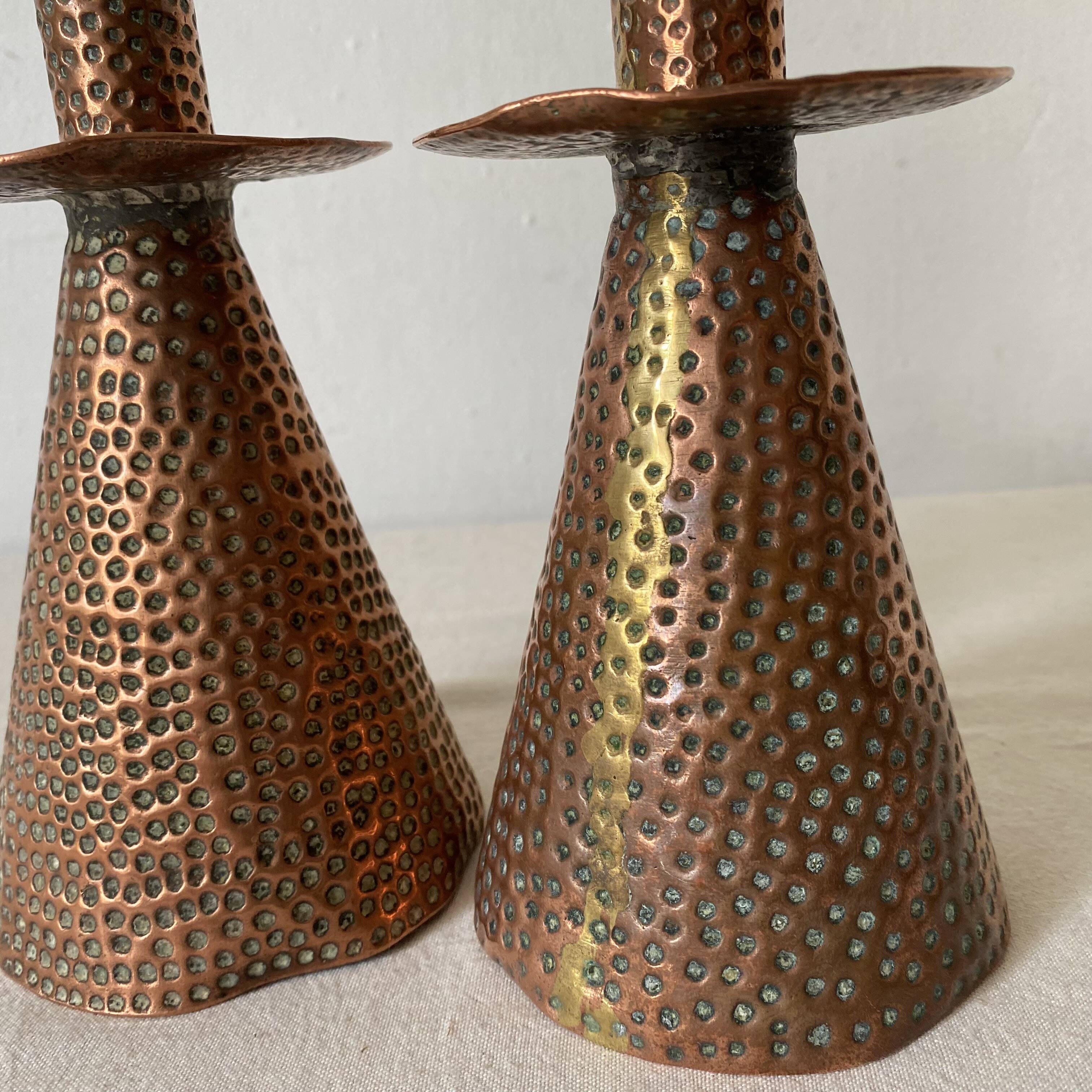 Pair of hammered copper candlesticks from the 1950s