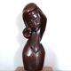 Wooden sculpture of a woman with a flower, 1970s