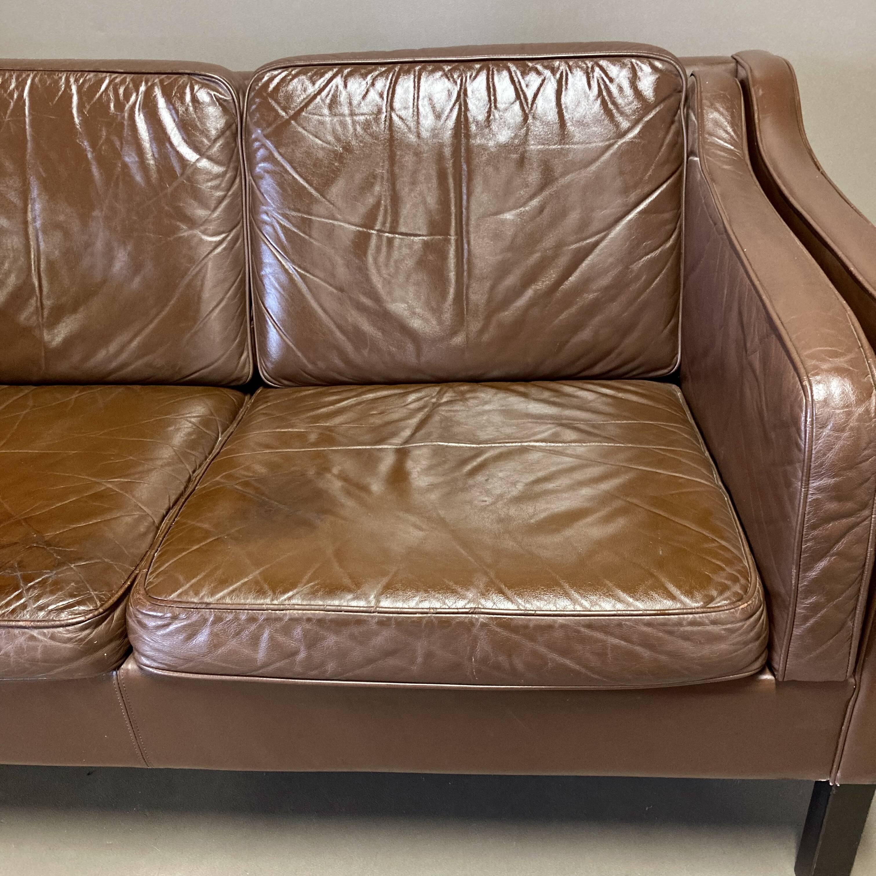 Scandinavian design 2-seater leather sofa.