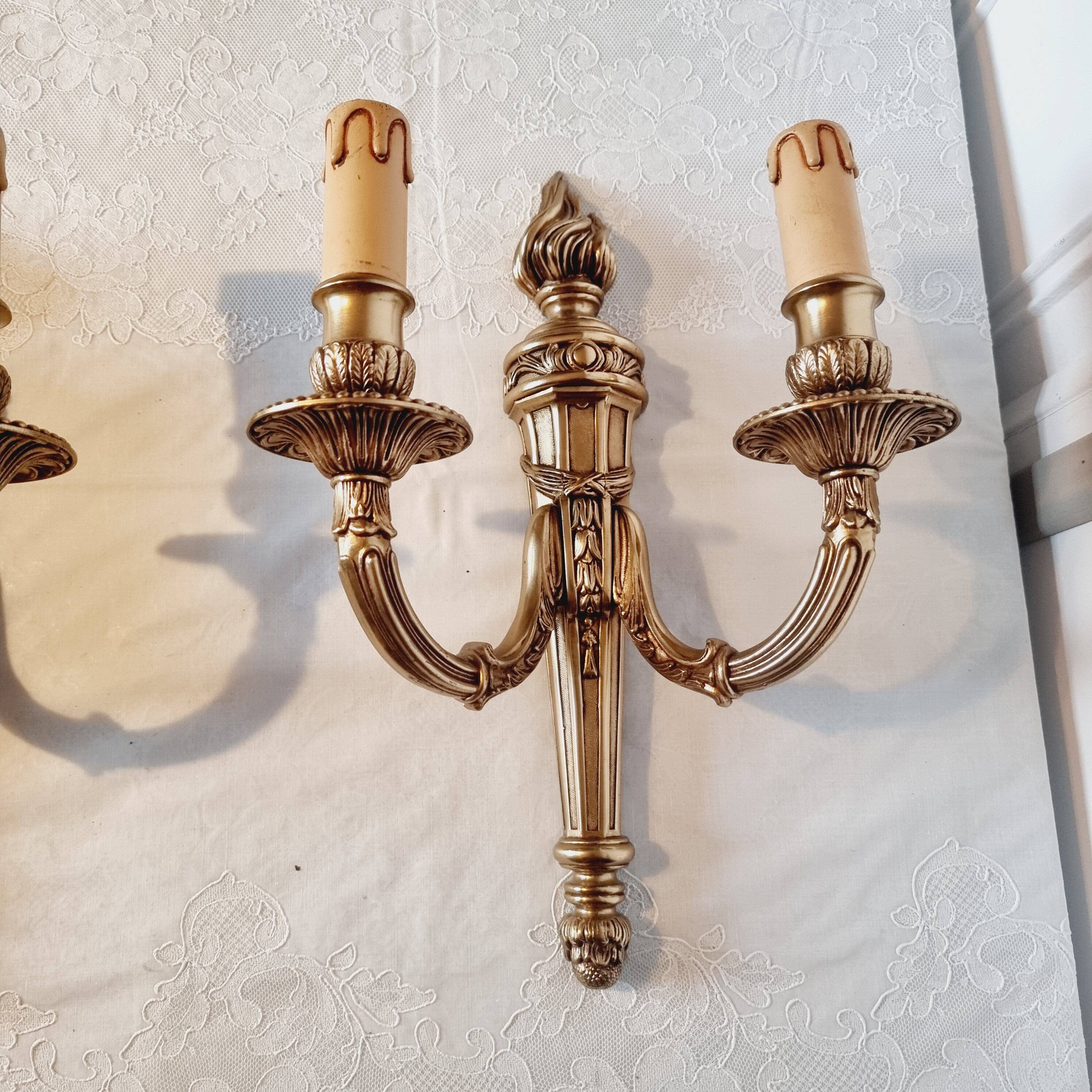 Pair of Louis XV style rocaille two-armed sconces in gilded bronze