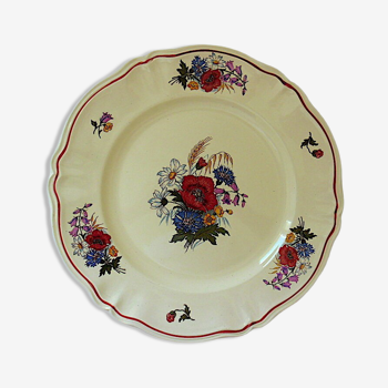 Circular dish with floral decoration and twisted edges