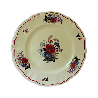 Circular dish with floral decoration and twisted edges