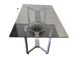 Table en métal chromé dessus verre fumé