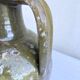 Ancient oil jar in glazed terracotta, khaki green — Auvergne, Lezou