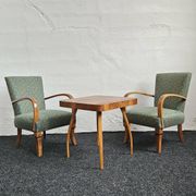 Halabala “Spider” coffee table and Hungarian late Art Deco armchairs, 1950s
