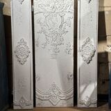 Wall decoration in three pieces, triptych of relief decoration on weathered wood, white and gold,