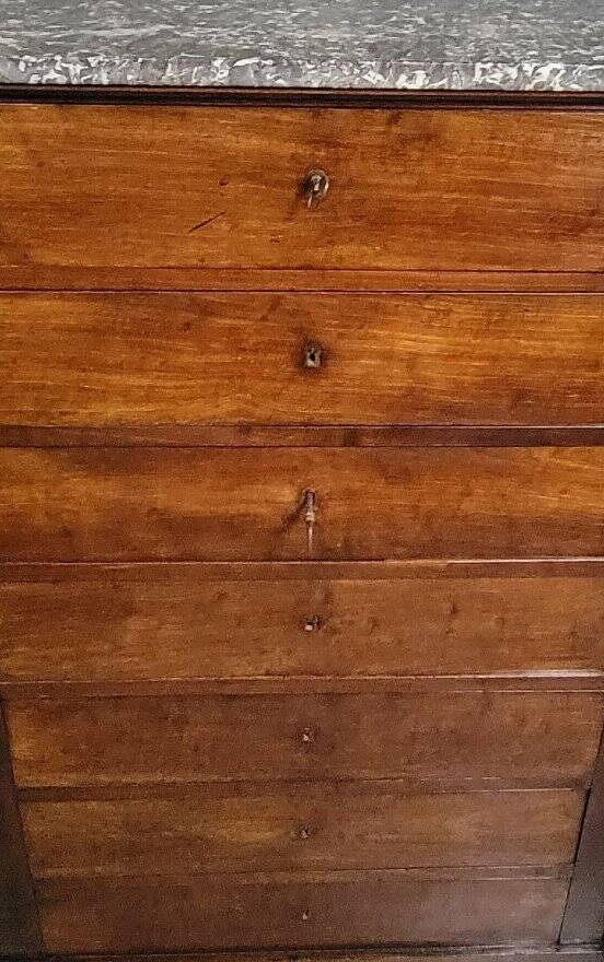Empire Restoration period chest of drawers in mahogany, with a marble top.