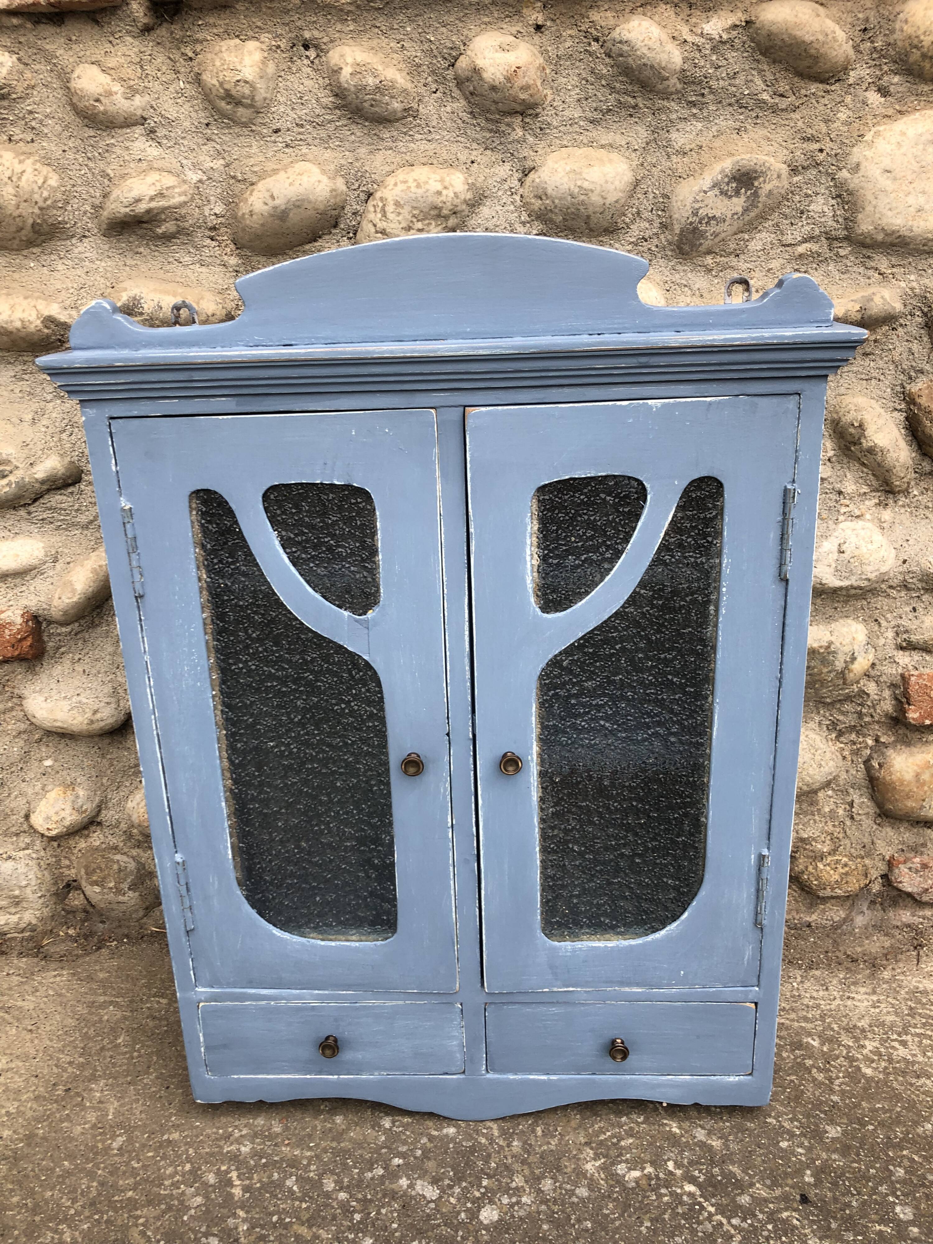 Pastel patinated medicine cabinet