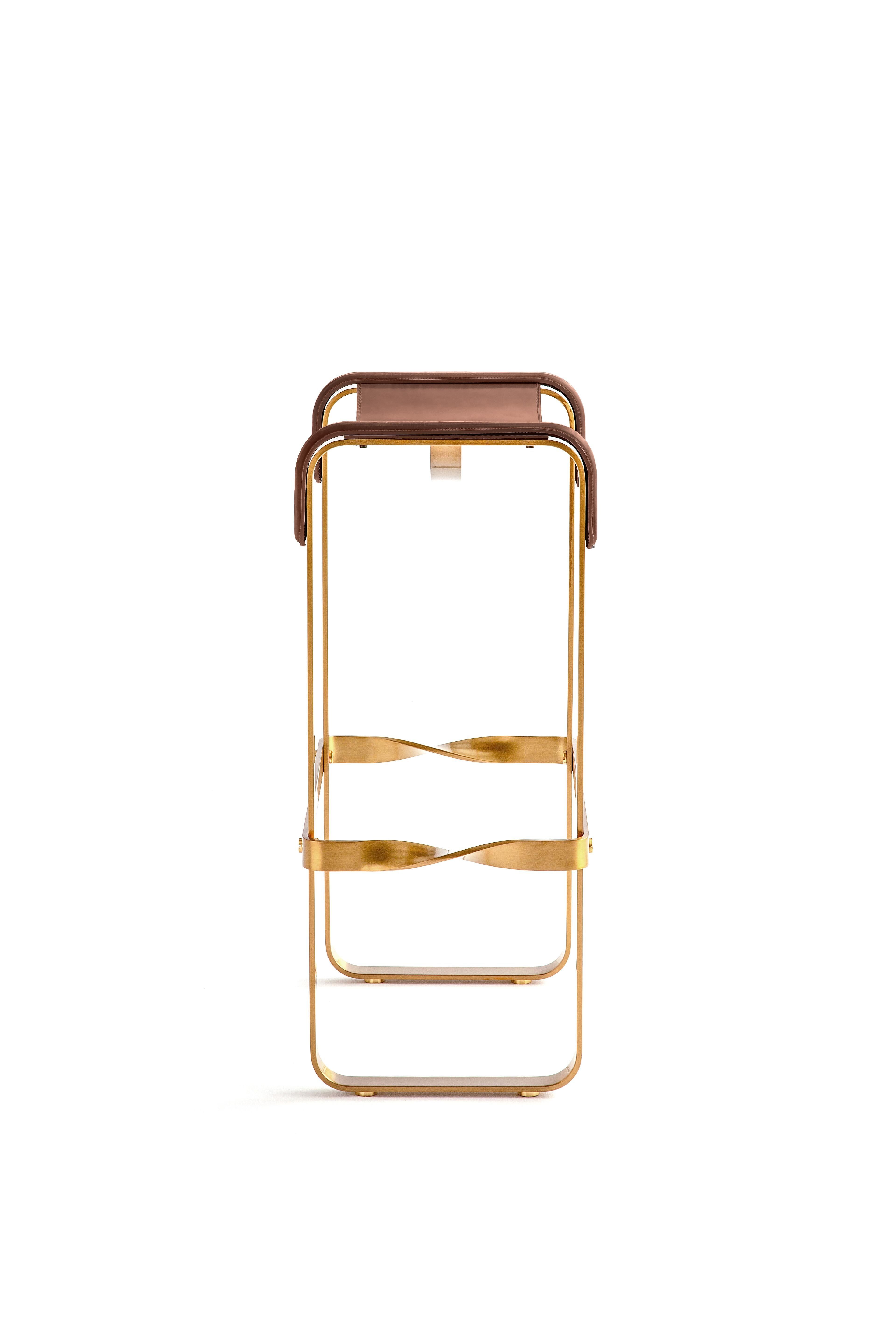 Contemporary kitchen stool, aged brass metal and cognac leather.