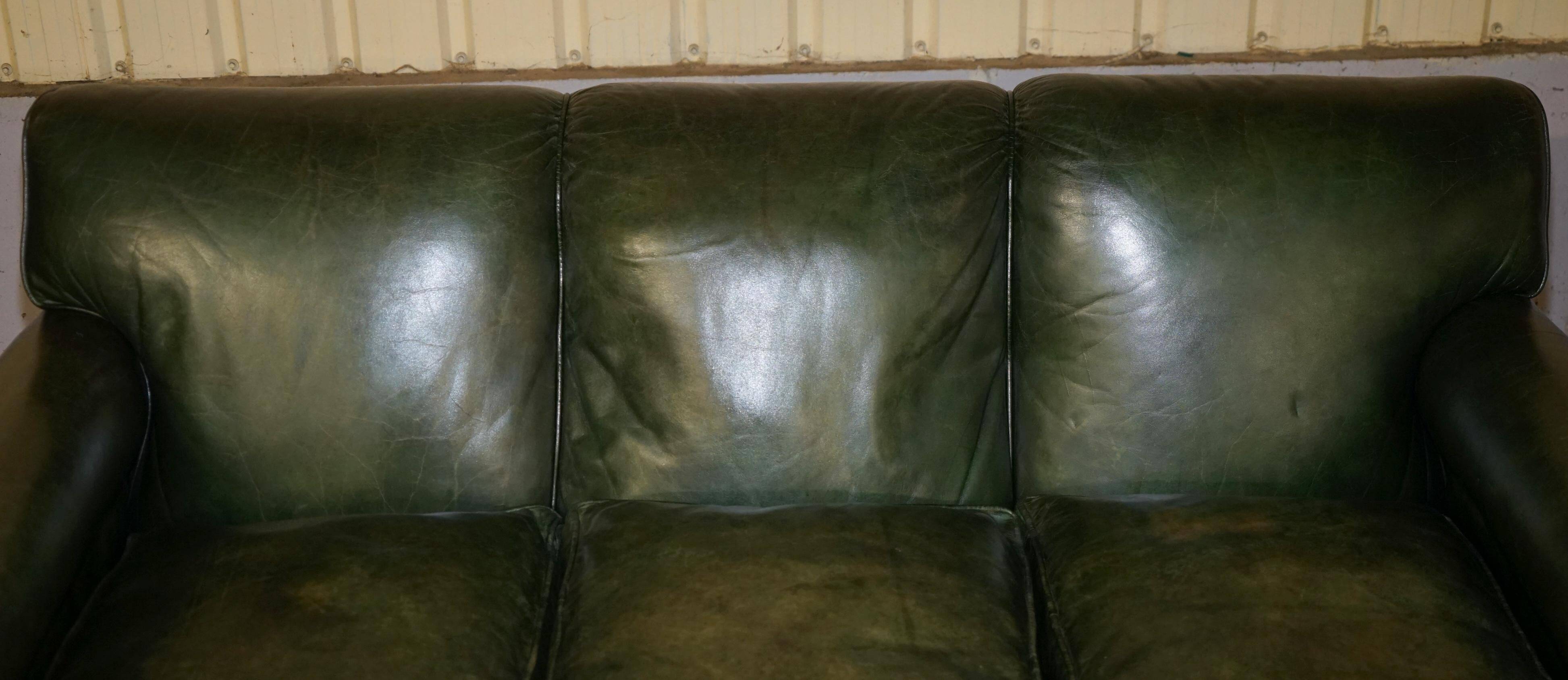 Victorian leather canapé, shield armrests, stamped Maple & Co.