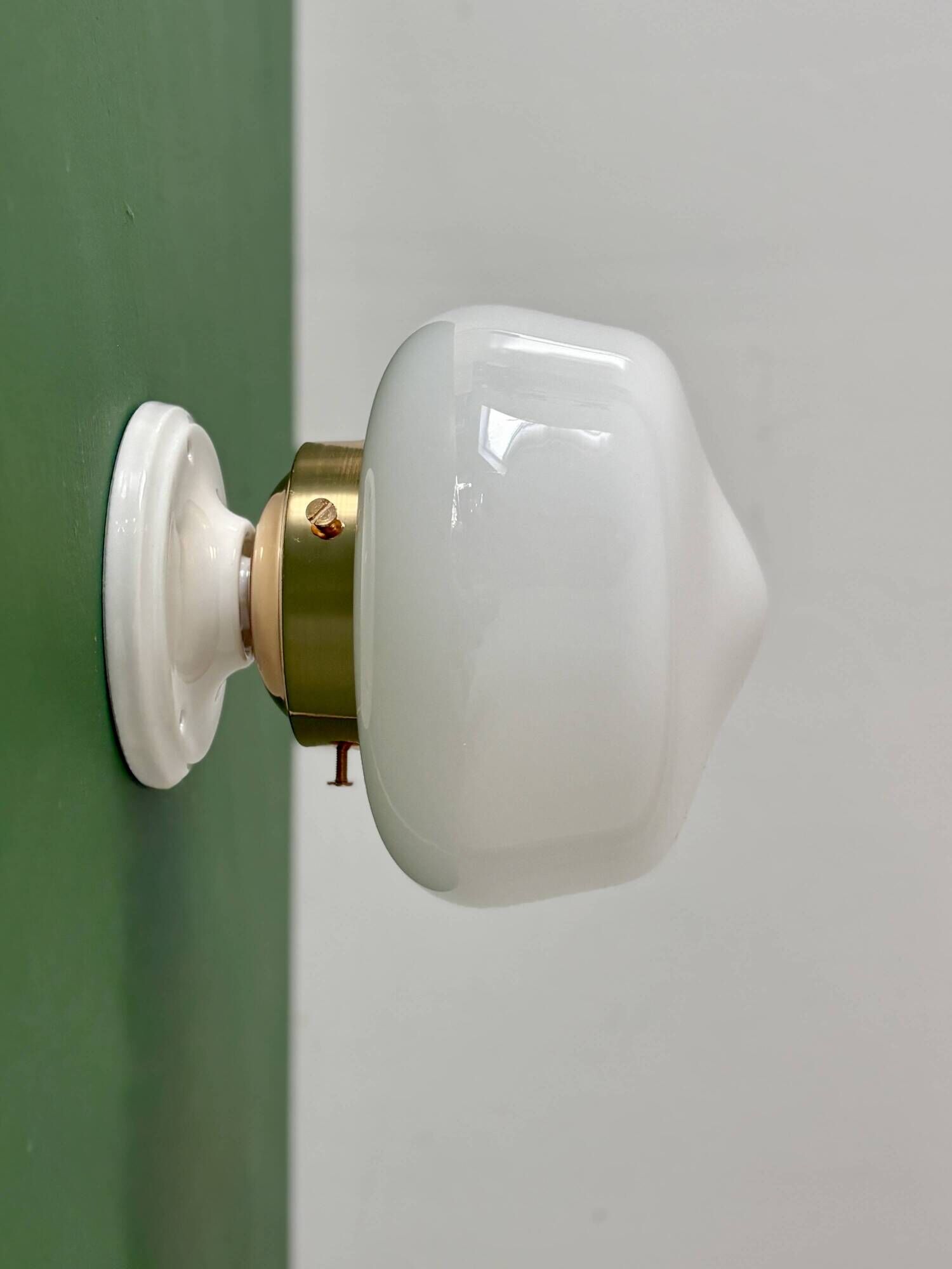 Vintage Art Deco globe wall light in white opaline.