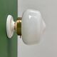 Vintage Art Deco globe wall light in white opaline.