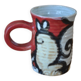 Glazed stoneware mug with snail motif signed