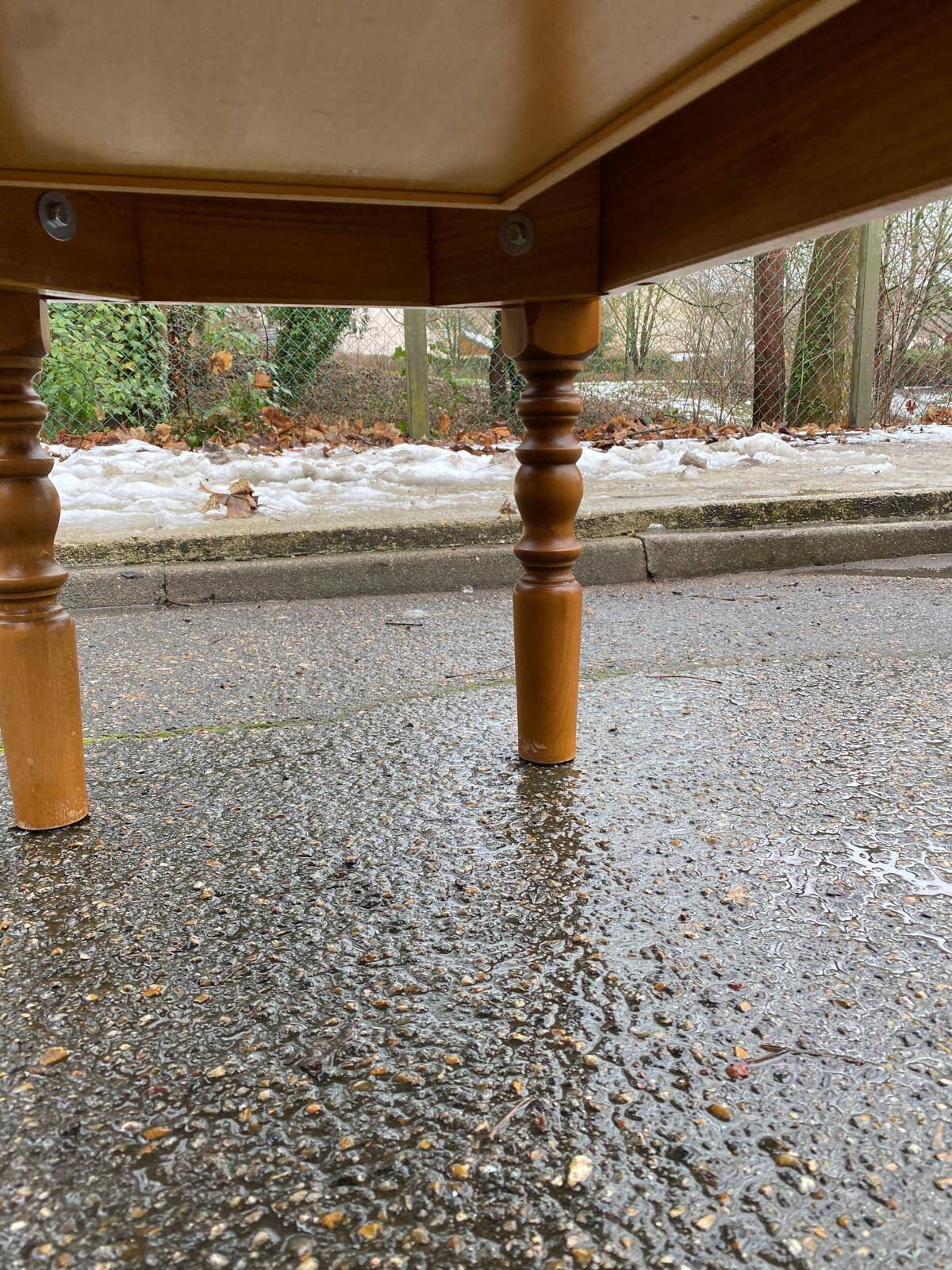 Light solid wood coffee table with tiles and a drawer.