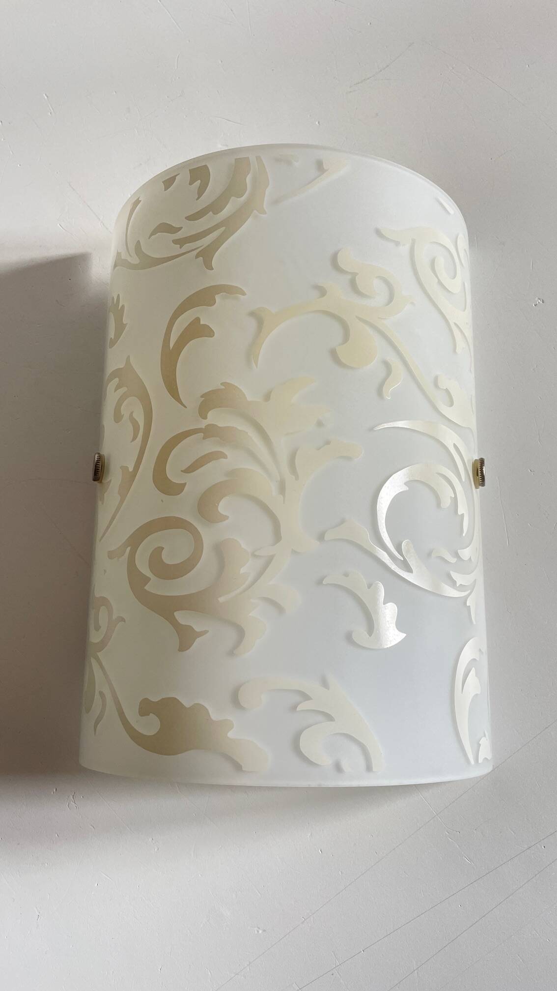 Polished and screen-printed glass sconce by eglo