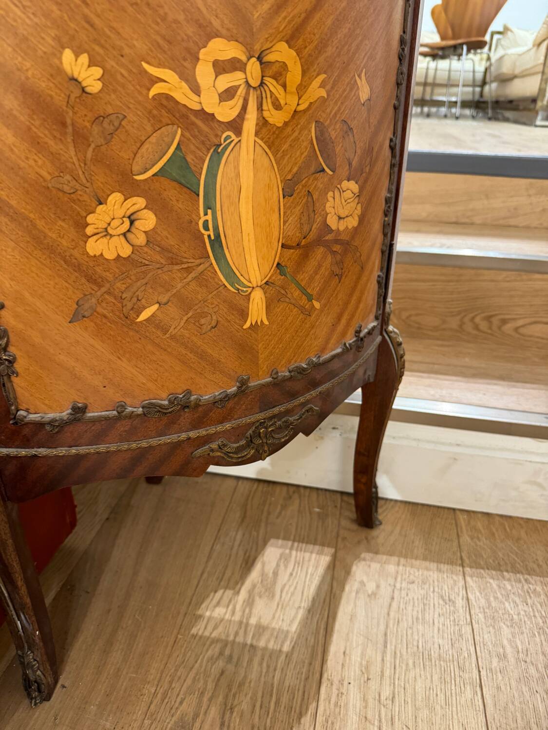 Corner display case in wood veneer with musical instrument marquetry