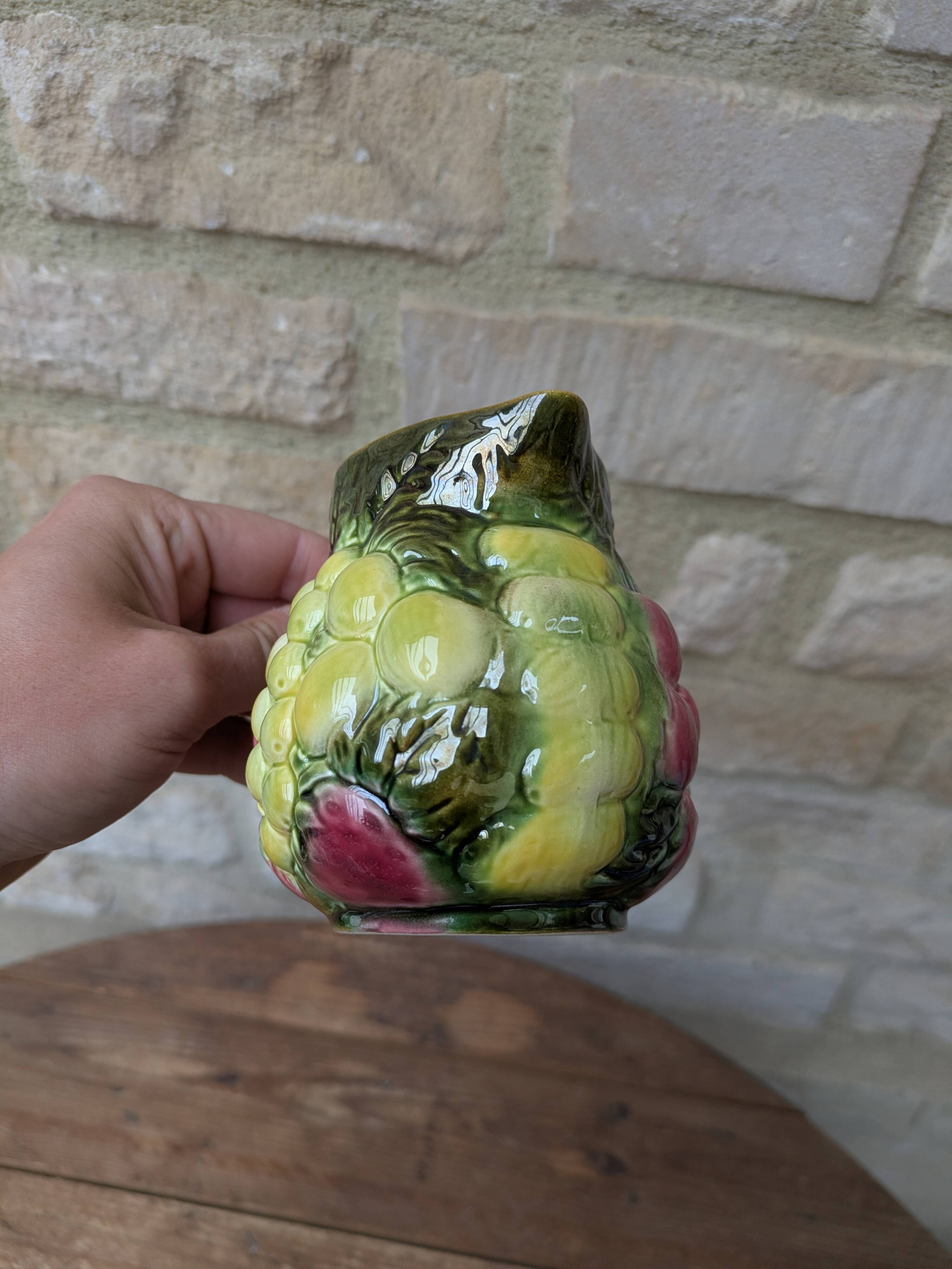 Small jug, milk pot in slipware with relief fruits Salins les Bains