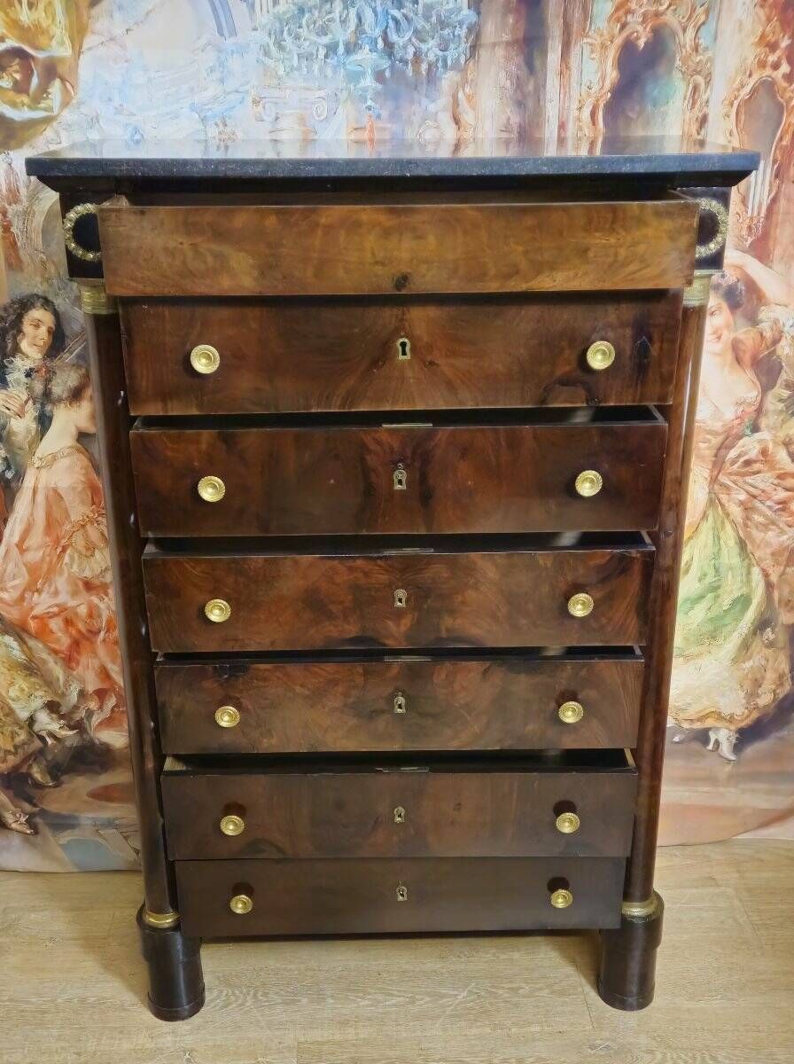 Empire period chest of drawers, early 19th century, in flame mahogany.