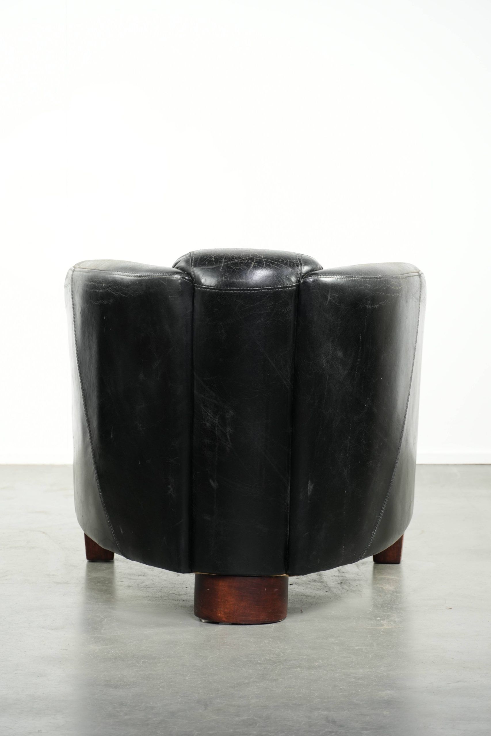Black vintage cowhide aviator design armchair with characterful appearance