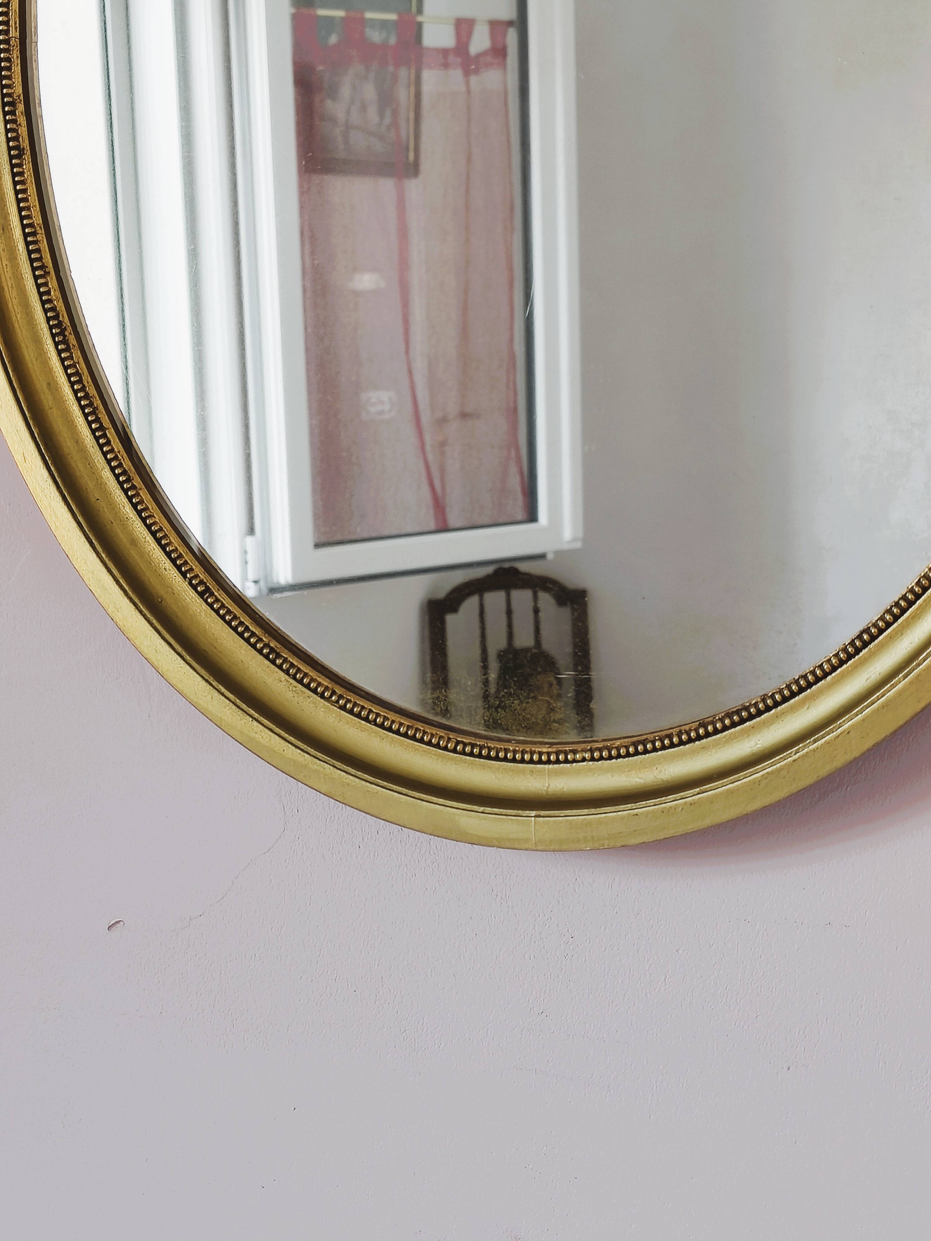 Antique gold oval mirror