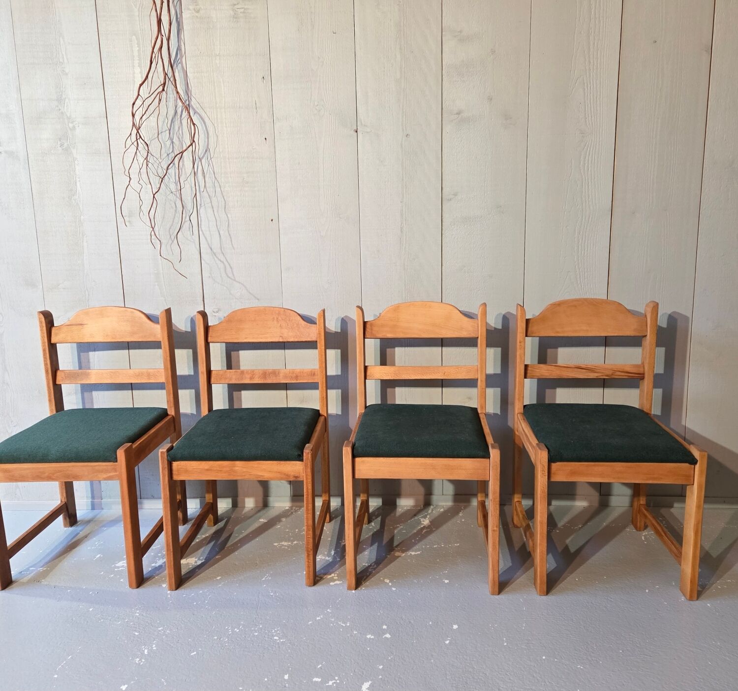 4 green tweed chairs