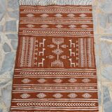 White and brown kilim carpet with gazelle patterns
