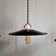 Three industrial suspensions in black enamelled sheet metal.