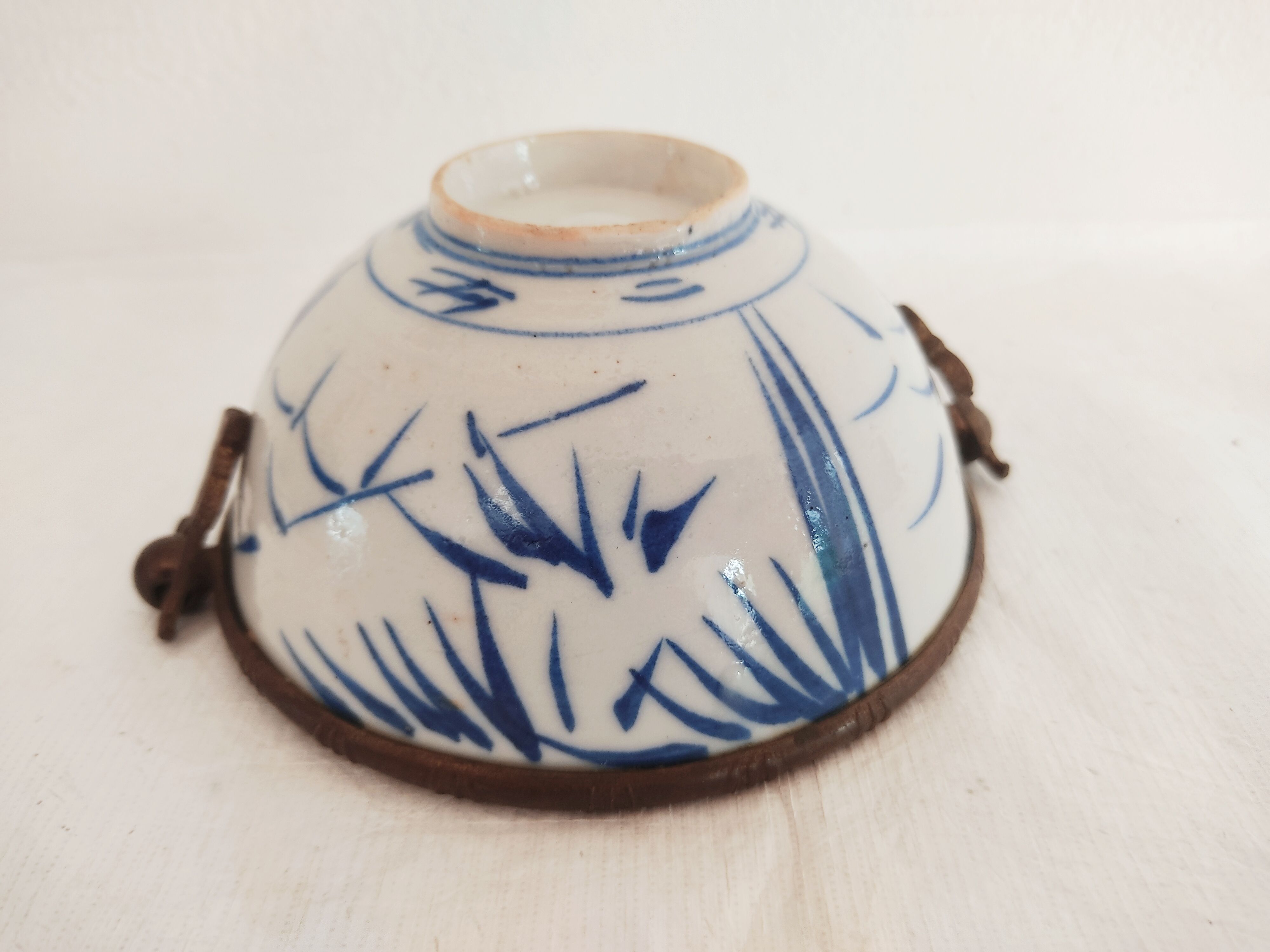 Asian bowl with metal frame imitating bamboo