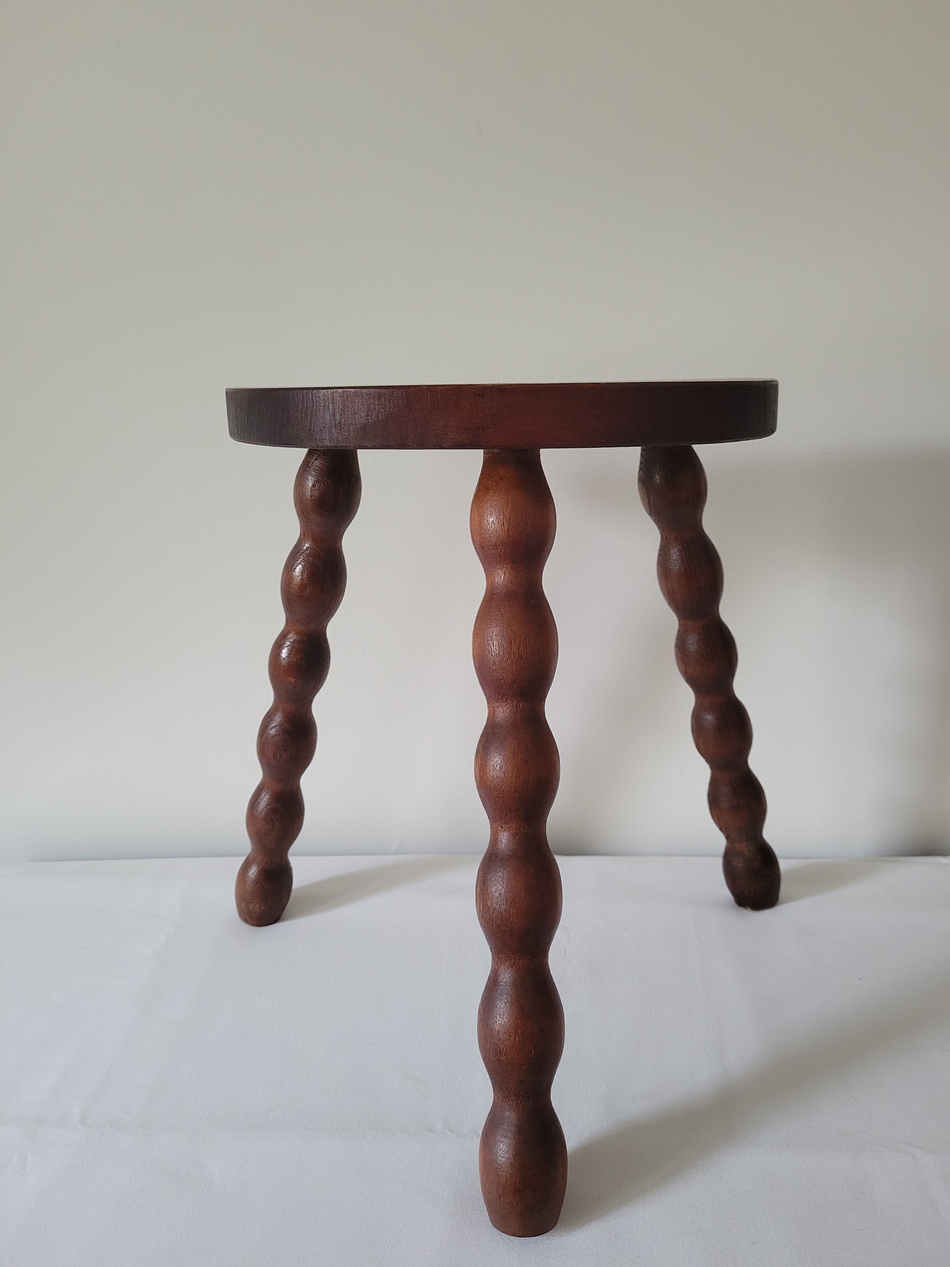 Brutalist stool turned wooden feet
