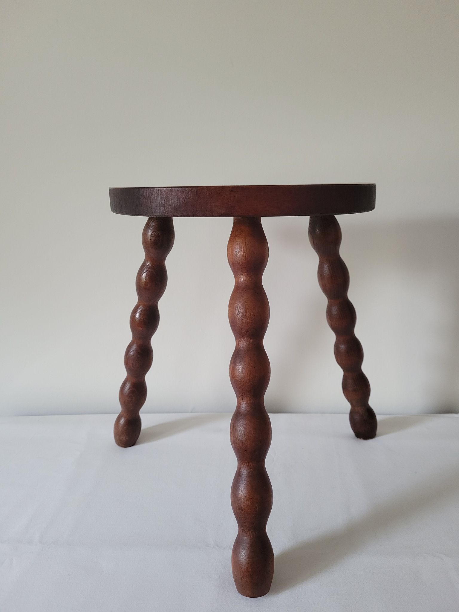Brutalist stool turned wooden feet