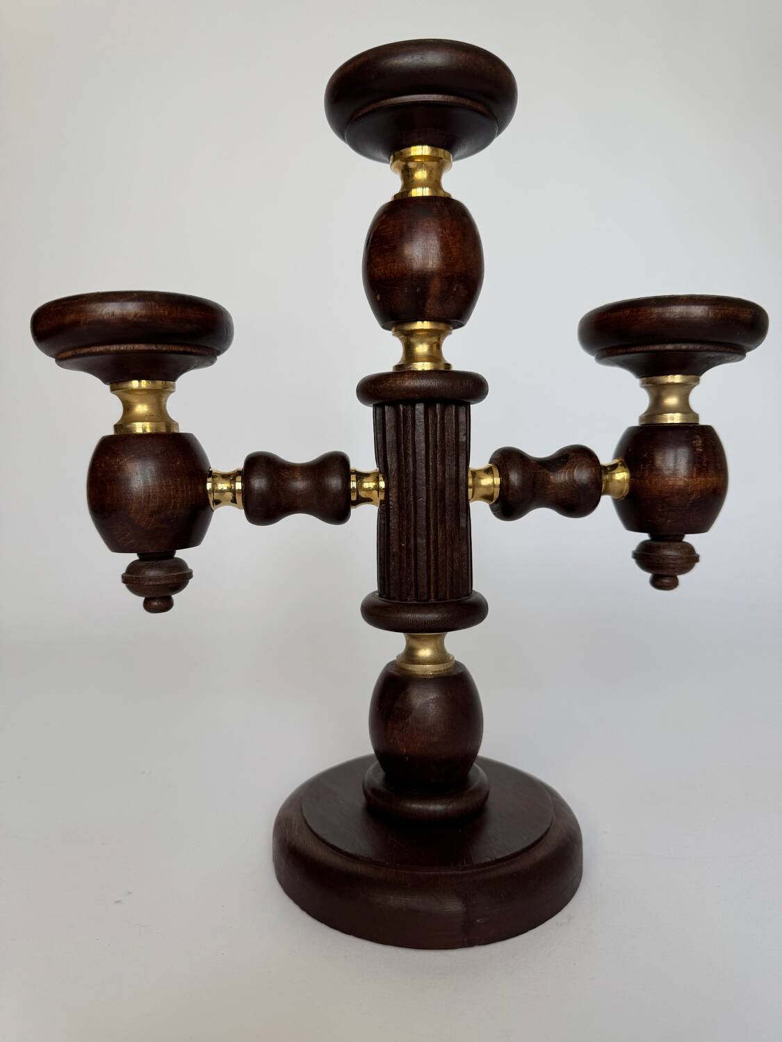 Vintage brutalist wooden candelabrum with gold hardware.