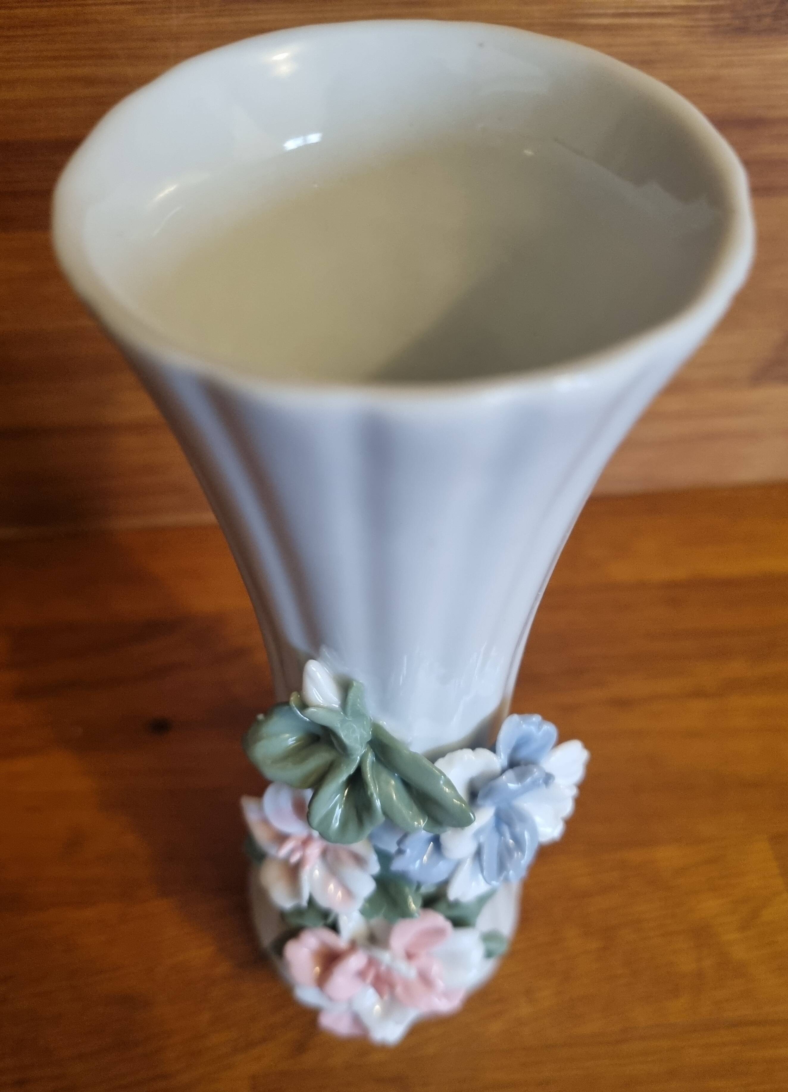 Porcelain vase with flowers in relief