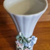 Porcelain vase with flowers in relief