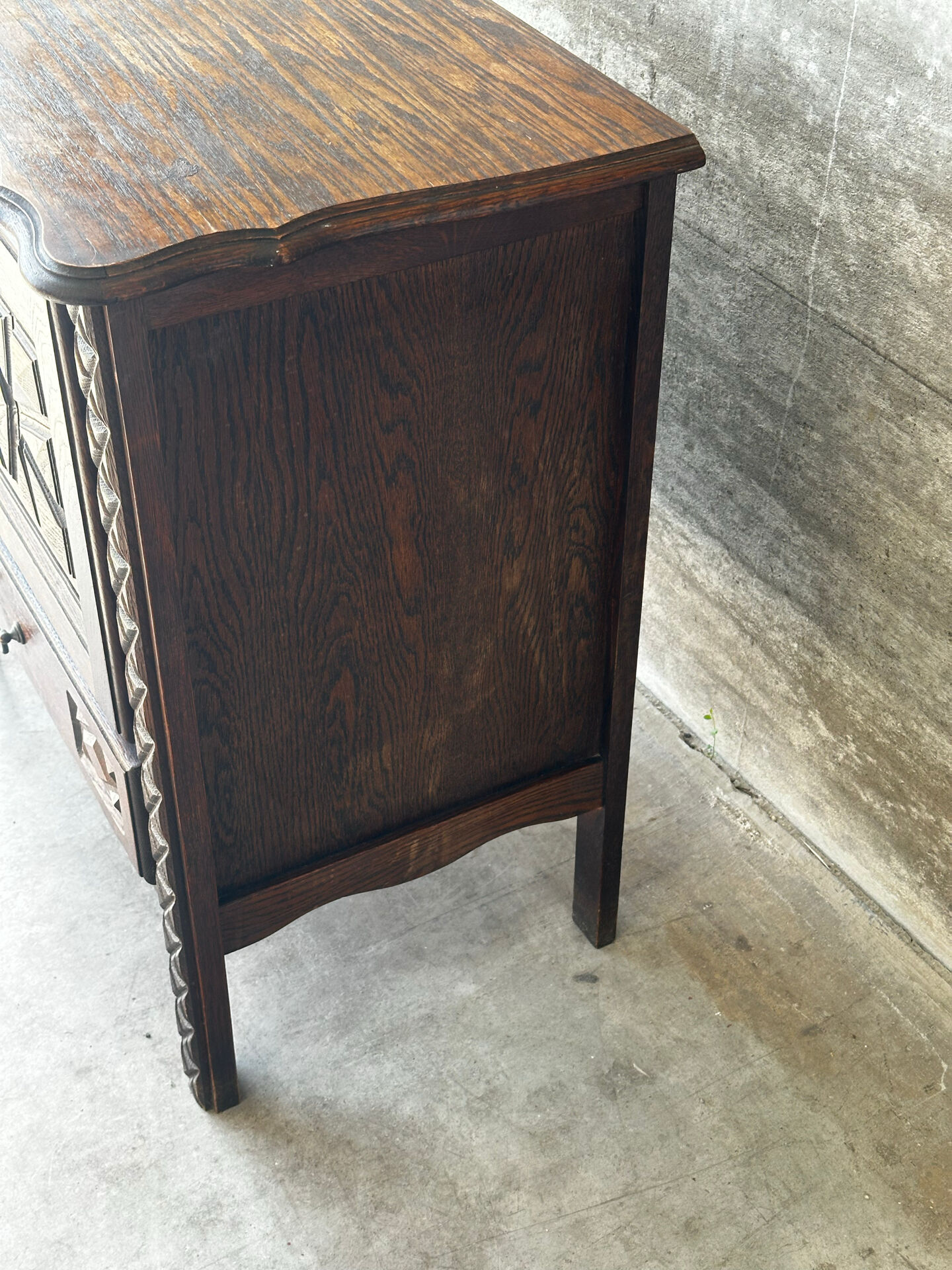 Small storage cabinet in carved oak – circa 1930