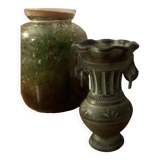 Ancient Greek style ceramic vase with curls
