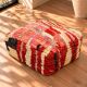 Vintage Moroccan pouf in multicoloured handmade wool.