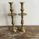 Pair of engraved brass candle holders