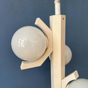 Mid-century white suspension with a bony design and opaline glass shade.