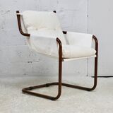 Tubular armchair, fabric suspended seat. Circa 1970