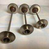Trio of metal and wood candlesticks