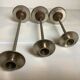 Trio of metal and wood candlesticks