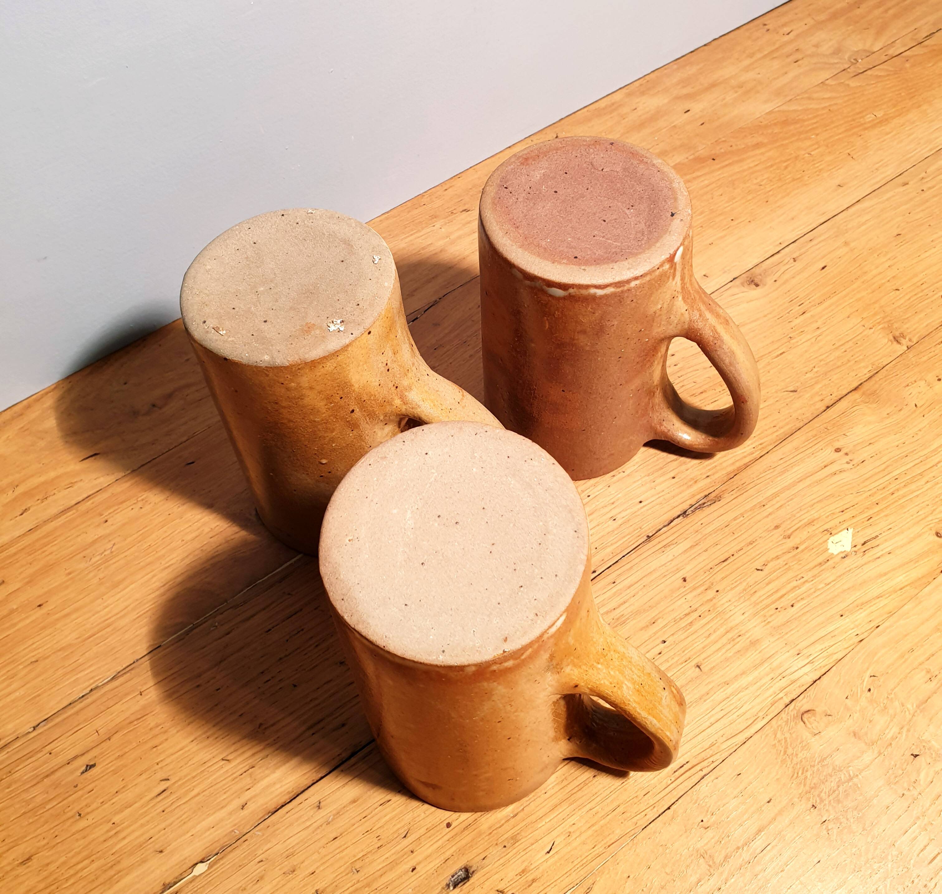 Set of three large sandstone mugs