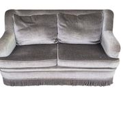 Vintage taupe two-seater armchair/sofa with fringes.
