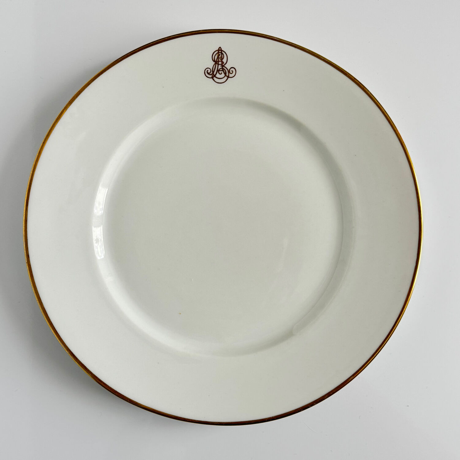 Set of monogrammed plates with gilt edges | E. Bourgeois | Late 19th century