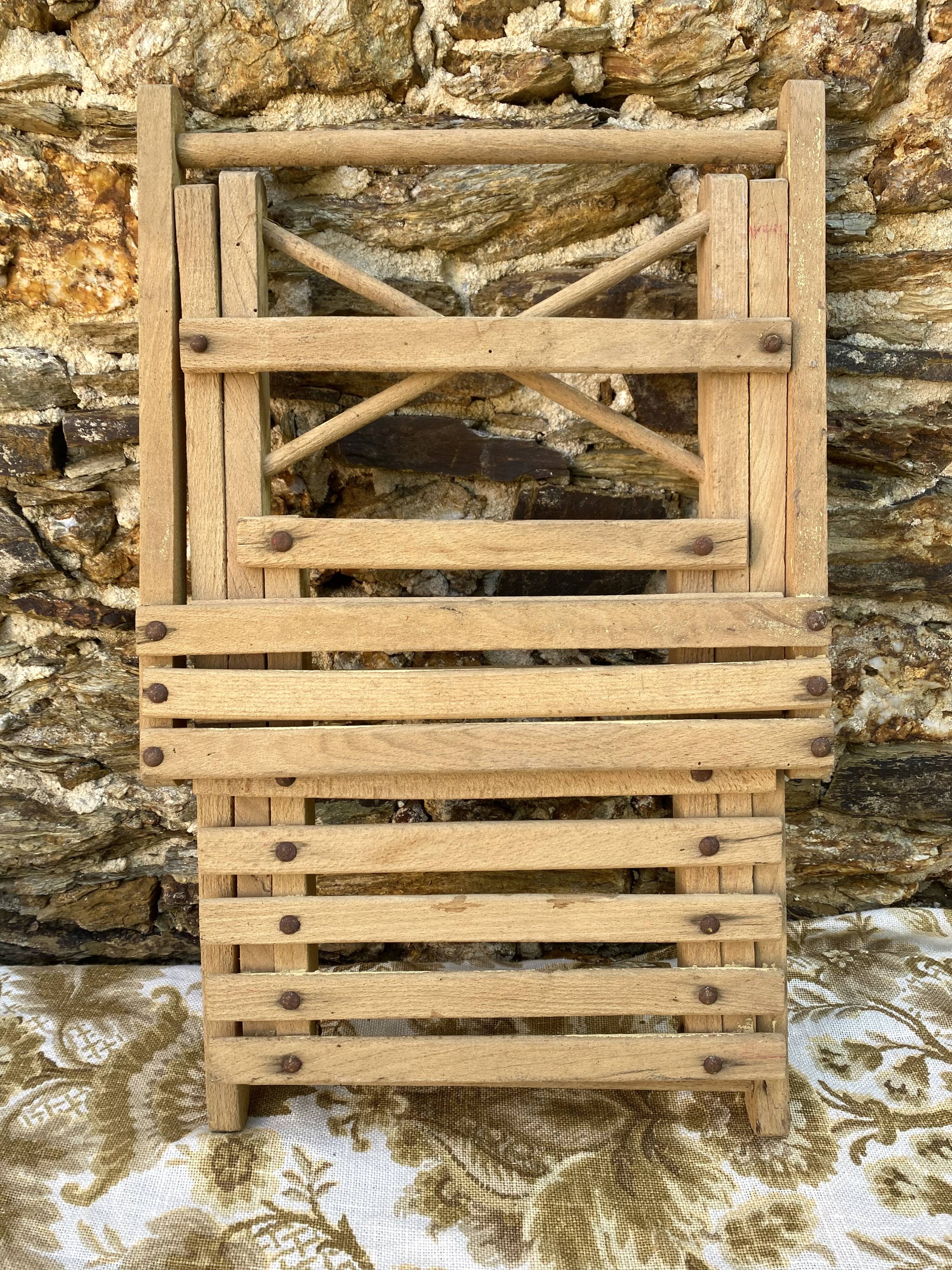 Antique folding chair with wooden slats