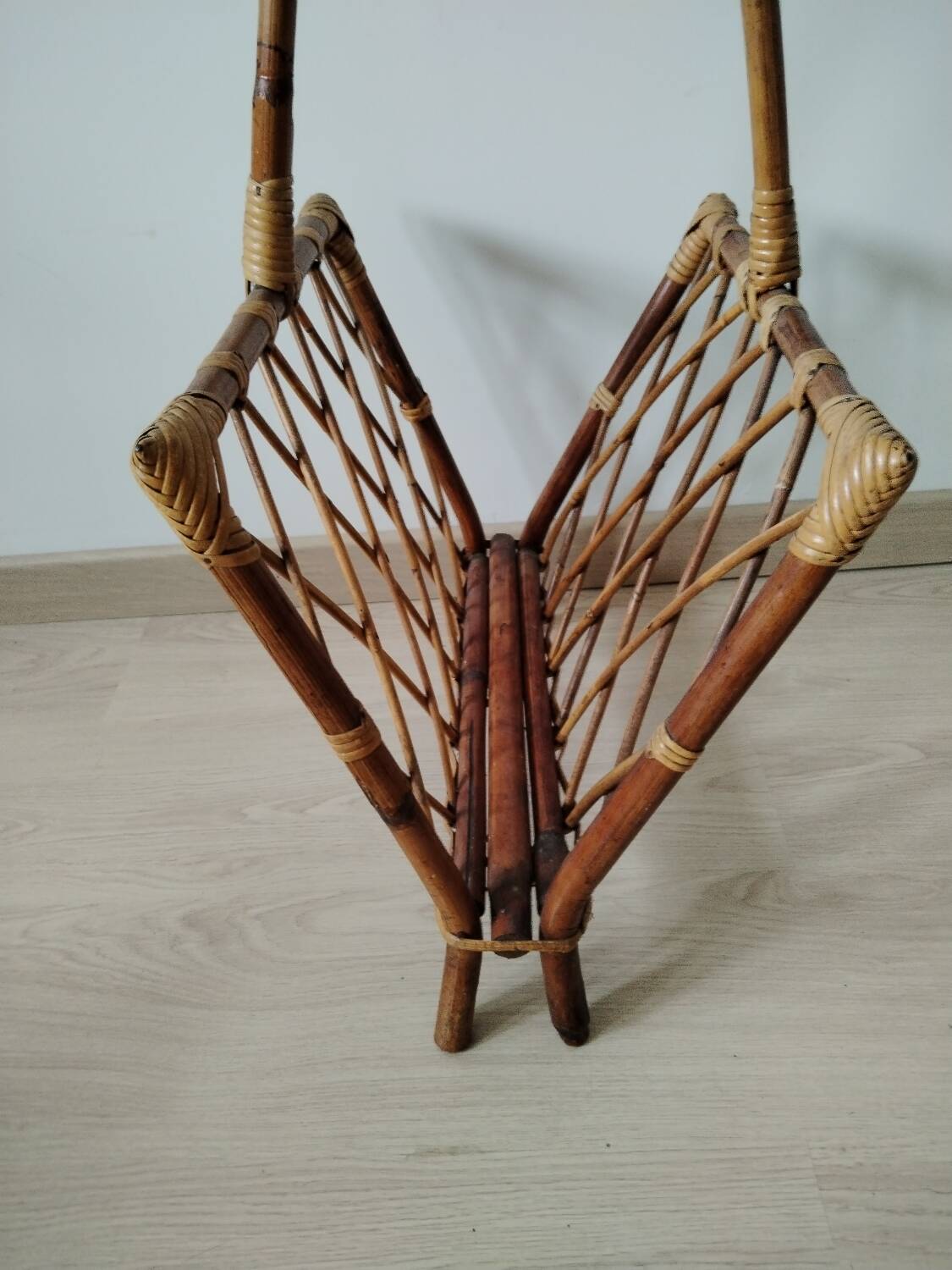 Rattan magazine rack from the 1950s