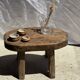Small stool, oval solid teak side table with curved legs in wabi-sabi style.